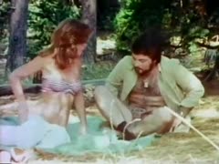 A passionate couple is hard at work in the wilderness.